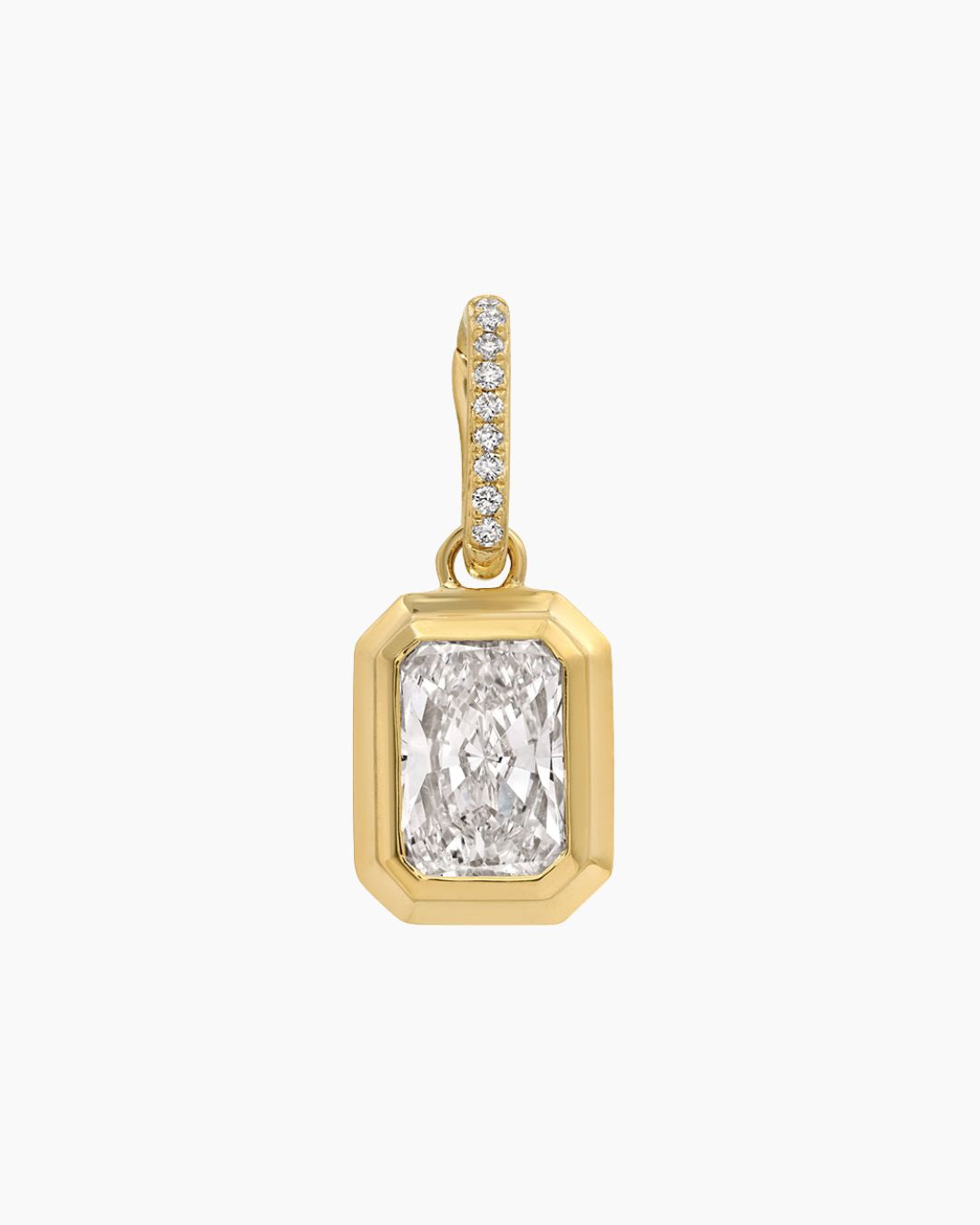 A yellow gold pendant featuring a large rectangular emerald-cut diamond in a beveled setting, with a pavé diamond bail at the top, shown on a plain white background.