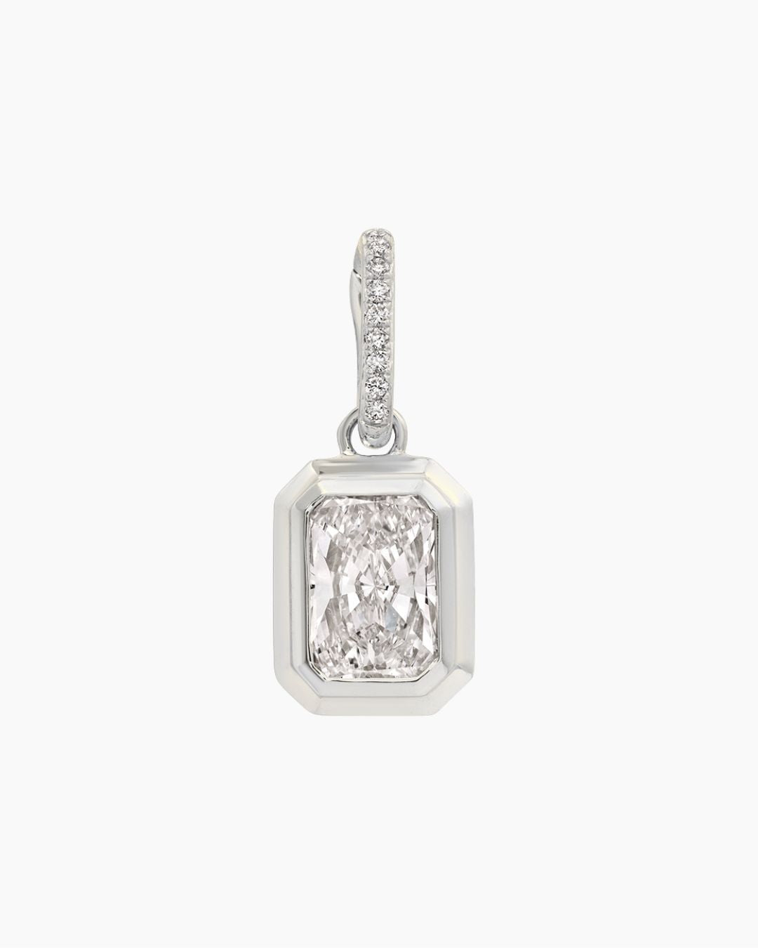 A white gold pendant featuring a large rectangular emerald-cut diamond in a beveled setting, with a pavé diamond bail, shown on a plain white background.