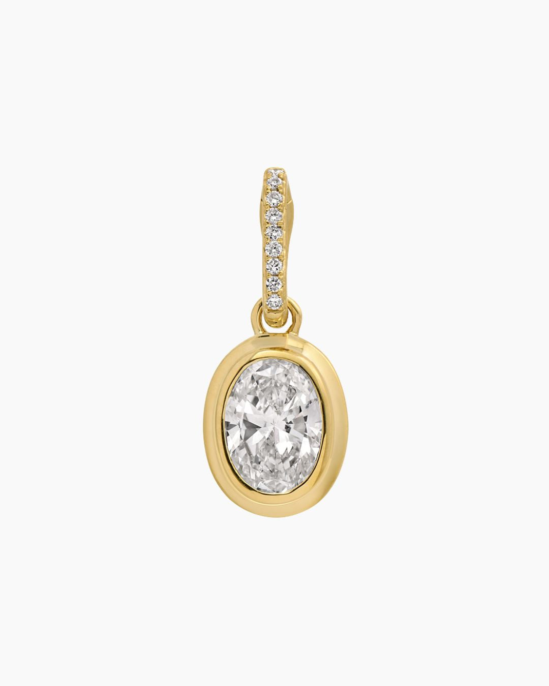 A yellow gold pendant featuring a large oval-cut diamond in a bezel setting, with a decorative bail adorned with small pavé-set clear stones, shown on a plain white background.